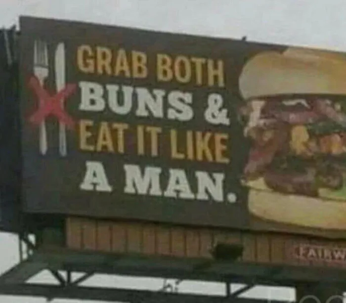 A billboard reading Grab both buns, an example of advertising fails.
