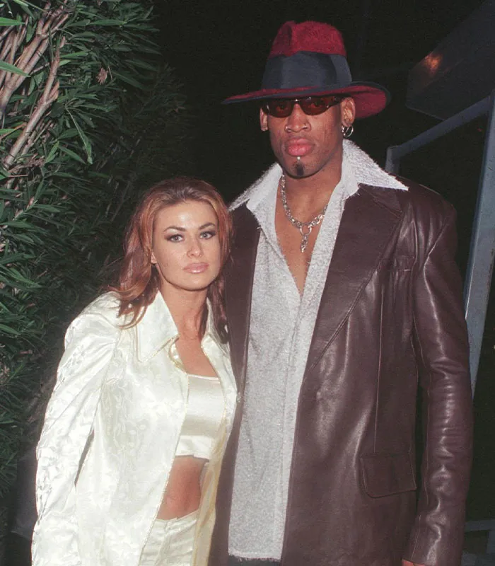 Carmen Electra alongside Dennis Rodman, remembered for their brief short celebrity marriages.