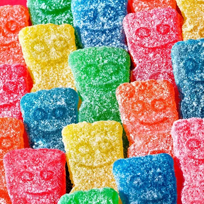 A colorful array of Sour Patch Kids gummies, widely considered among the best Halloween candies.