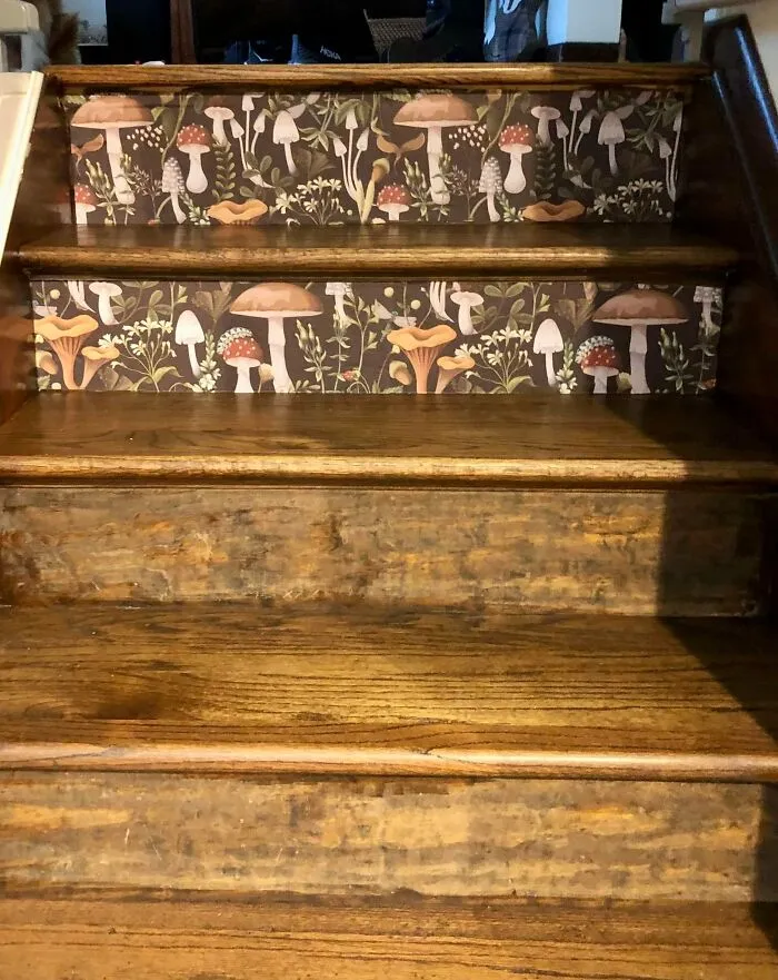 Staircase home makeover featuring mushroom pattern wallpaper applied to wooden risers.