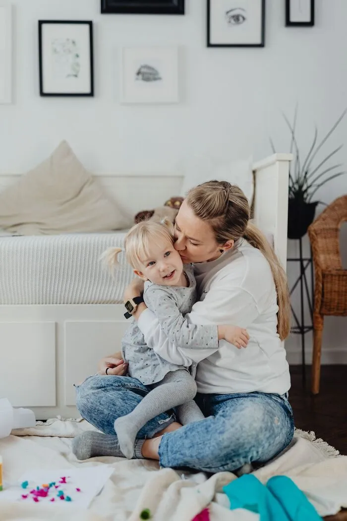 A mother embracing her young daughter, reflecting unexpected moments that lead people to choose divorce.