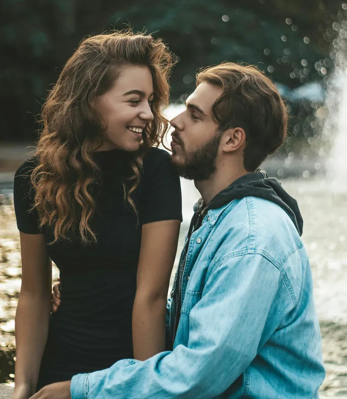 A happy young couple sitting together, representing stories and rants about relationships.