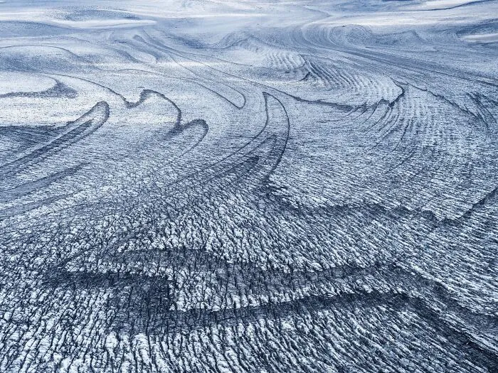 Natural landscape photography awards winning view of textured ice and glacier patterns