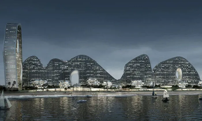 Modern wavy skyline with unique curved architecture by waterfront at dusk