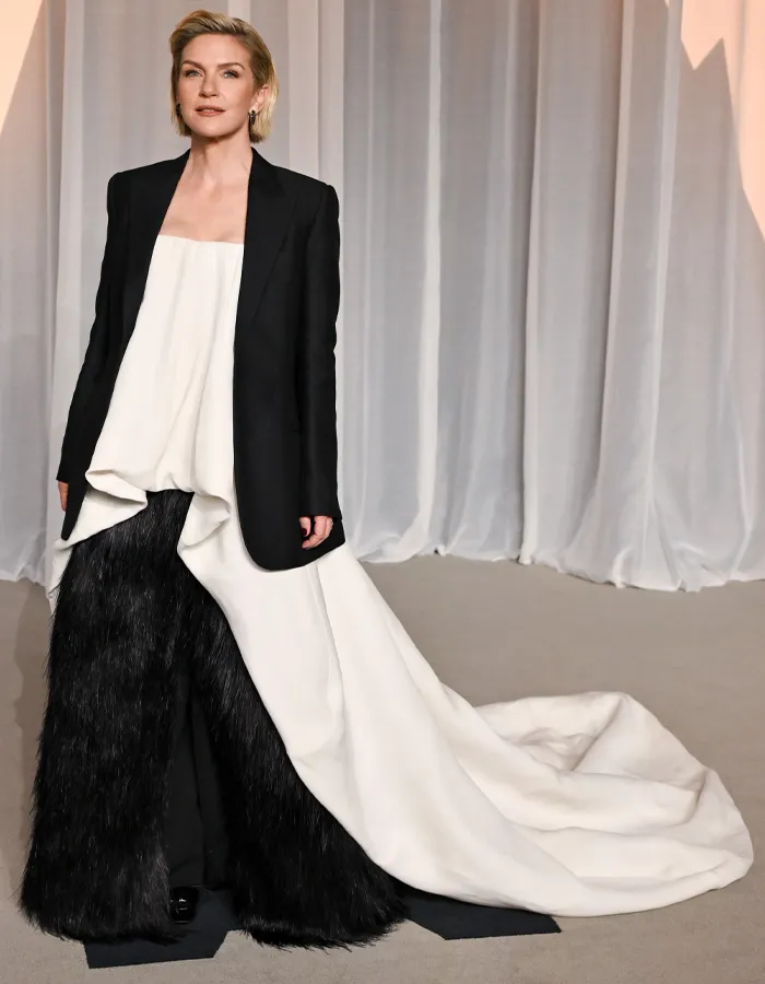 Woman in black and white outfit with fur pants at Academy Museum Gala