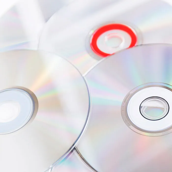 A pile of shiny compact discs that feature in bitter divorce stories