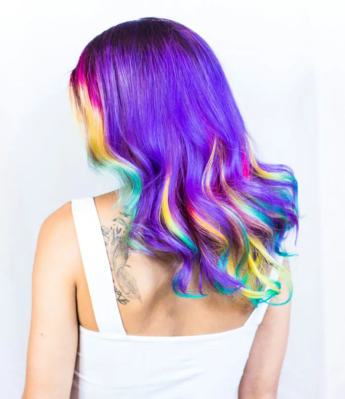 Woman showcasing vibrant colorful hair, an unusual style in bridezilla stories