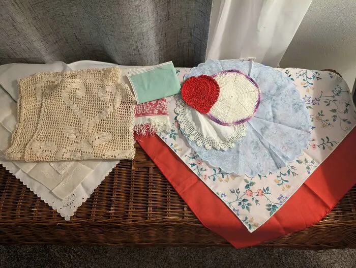 Assorted vintage table linens and doilies thrift store find
