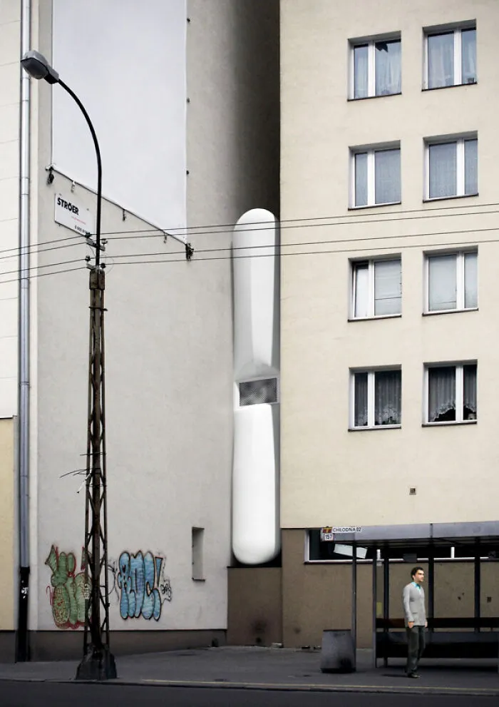 Narrow strange building squeezed between apartment blocks showing unusual architecture