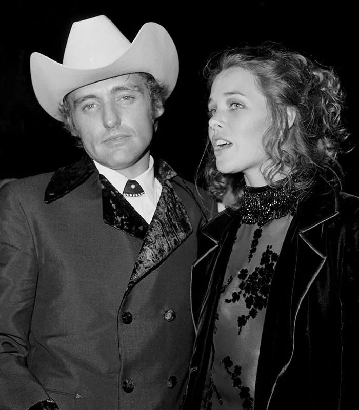 Dennis Hopper and Michelle Phillips attending an event during one of the short celebrity marriages in history.