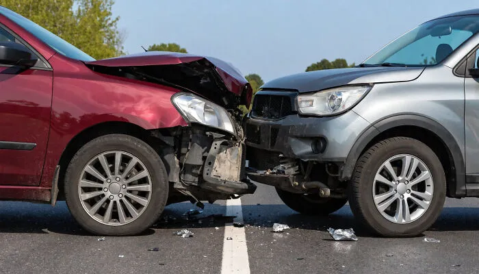 Frontal car crash on a highway triggering fight-or-flight instincts during an emergency