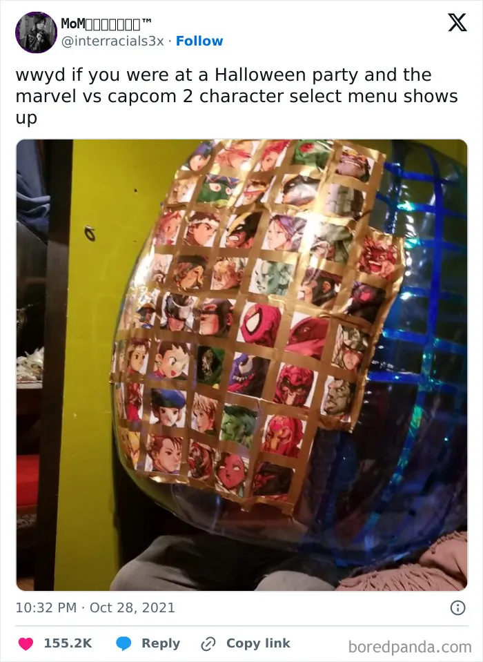 Funny Halloween tweet featuring a handmade costume shaped like the Marvel vs Capcom 2 character select grid.