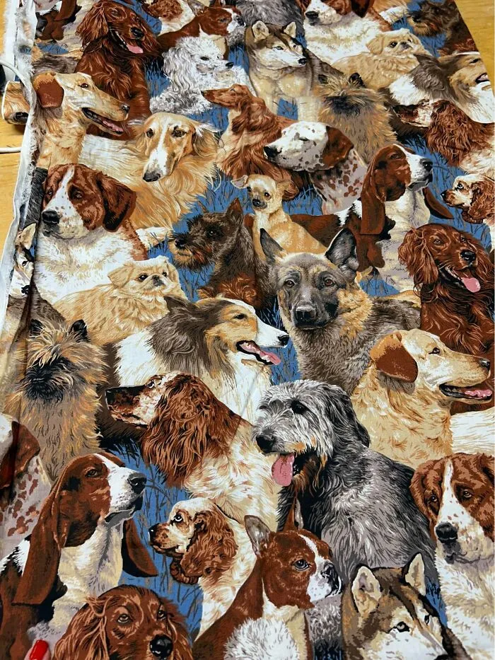 Fabric with multiple dog breeds printed on it for craft or quilting