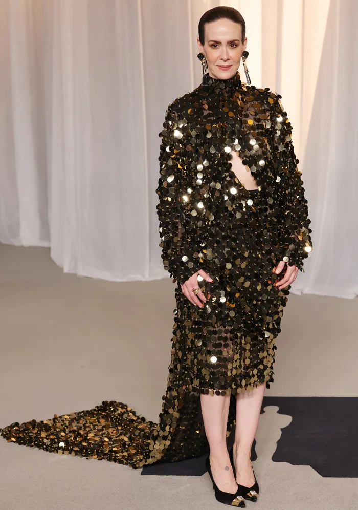 Black sequin-covered dress with high neck and train at Academy Museum Gala