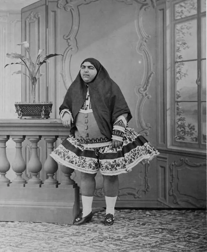 Vintage black and white portrait of a person in unique clothing, one of many interesting historical pics