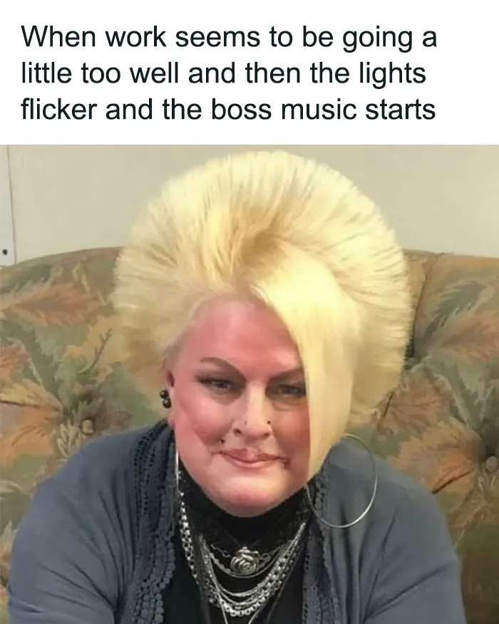 A woman with an exaggerated blonde Karen haircut sitting on a couch