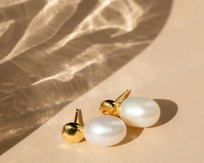 Pair of elegant pearl gold earrings tied to bridezilla stories about wedding jewelry expectations.