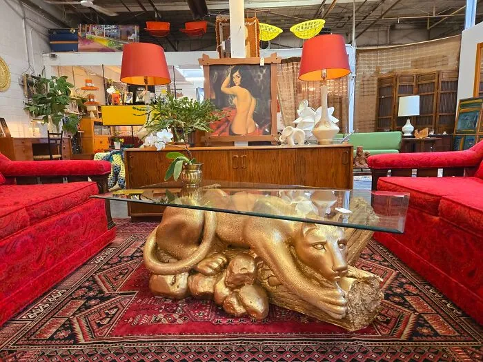 Unique panther coffee table base spotted among thrift finds.
