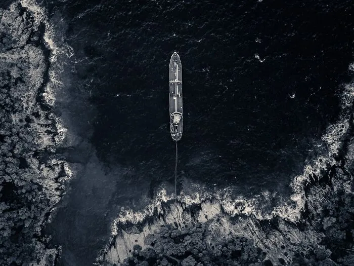 A black-and-white photo showing an aerial view of a boat in the water from the 2026 Exposure One Awards.