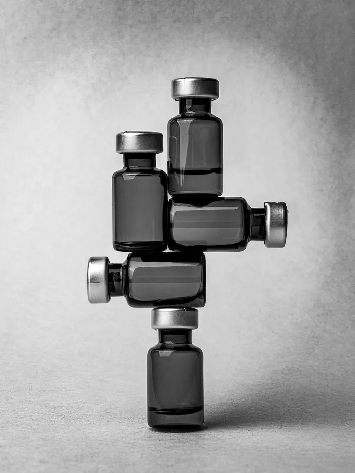 A black-and-white photo of stacked medical vials from the 2026 Exposure One Awards.