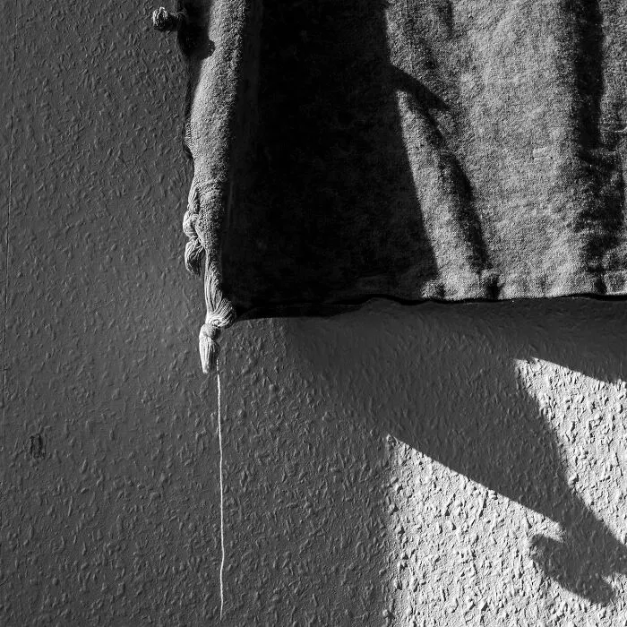 Close-up of fabric and shadows in black-and-white photos from Exposure One Awards