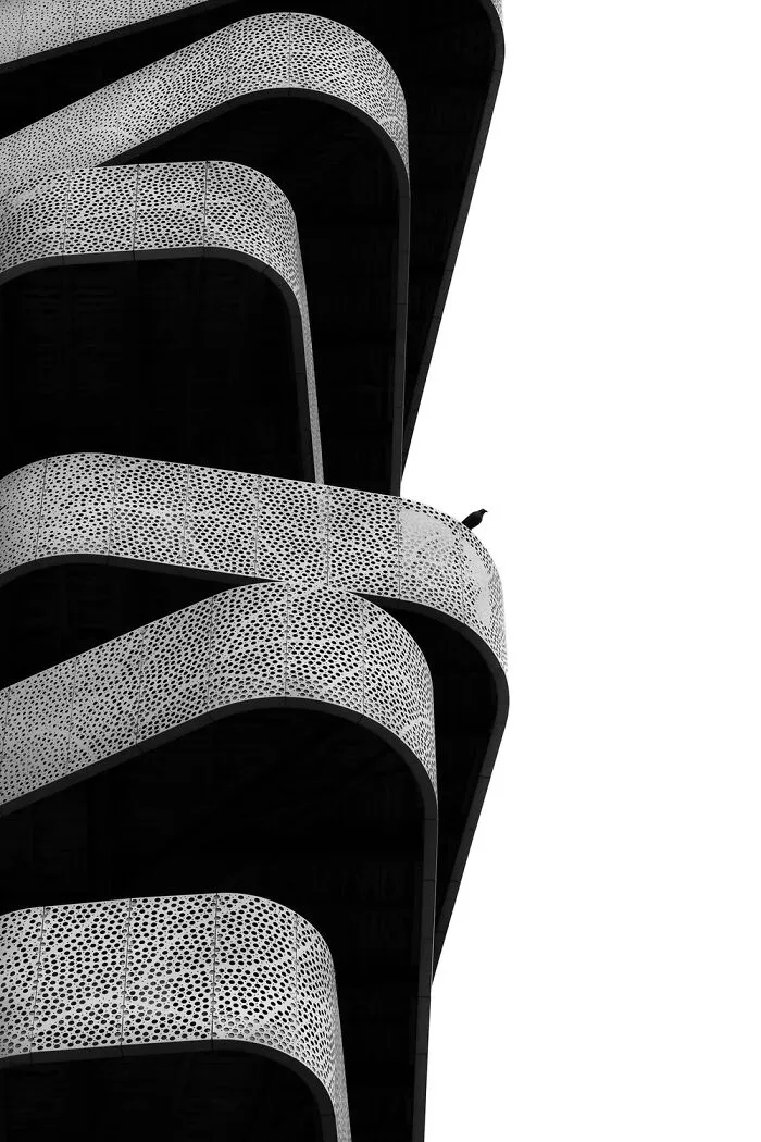 Curved modern architectural balconies featured in black-and-white photos