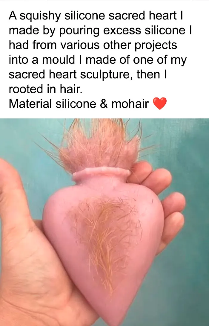 A weird pink silicone sacred heart craft with synthetic hair