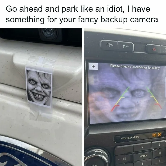 Funny vandalism prank with a scary face sticker taped over a car backup camera