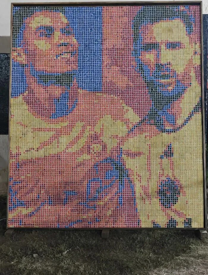 A detailed mosaic art piece made of colorful tiny squares depicting famous soccer players, creating a cool portrait