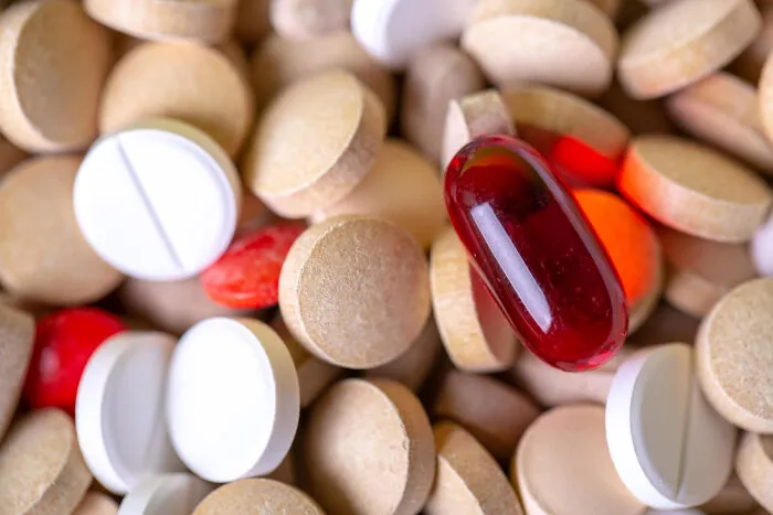 A pile of various pills and medication symbolizing bitter real-life divorce stories