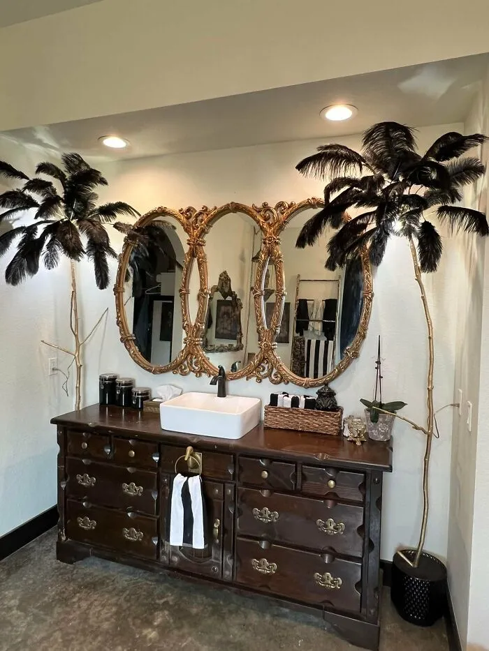 Eclectic bathroom vanity with feather palm trees created during a home makeover.
