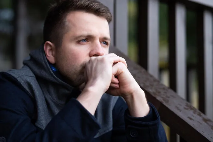 Thoughtful man looking away, reflecting on how his lifelong friendships fizzled out over the years.