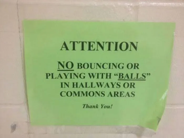 Green warning notice showing misused quotation marks around the word Balls