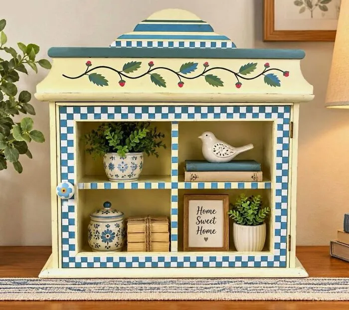Decorative checkered and floral shelf unit thrift store find