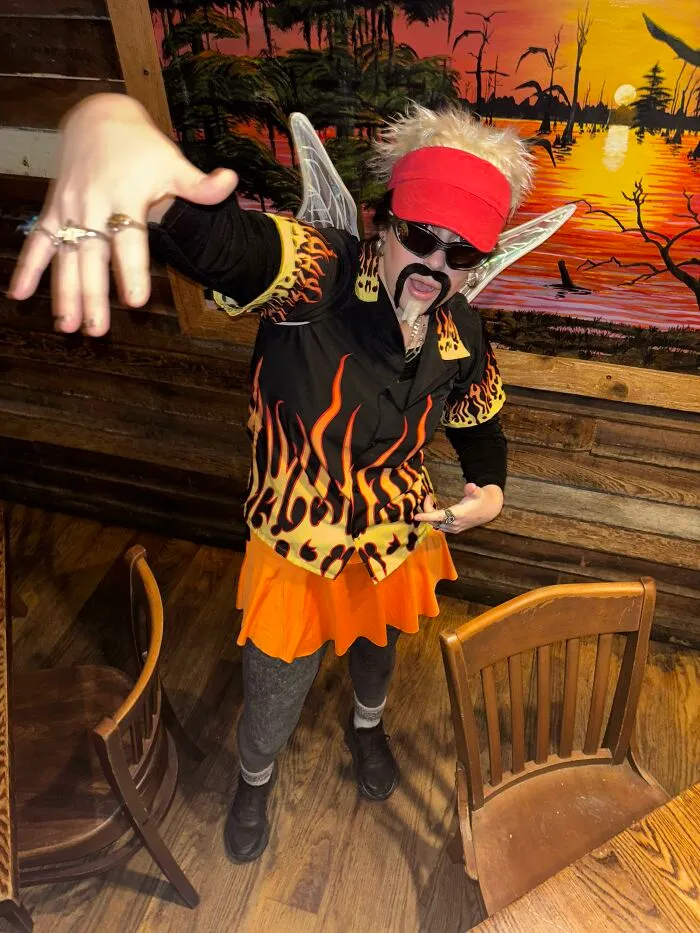 Person dressed as Guy Fieri fairy with wings for creative Halloween costume idea