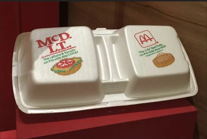 Vintage styrofoam McD.L.T. container showcasing nostalgic photos of classic 1980s fast food packaging