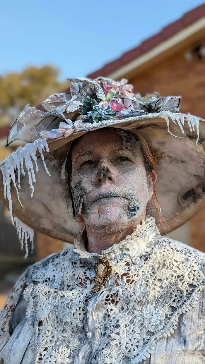 Detailed frozen ghost face makeup with an icy hat, offering creative Halloween costume ideas for a spooky look.