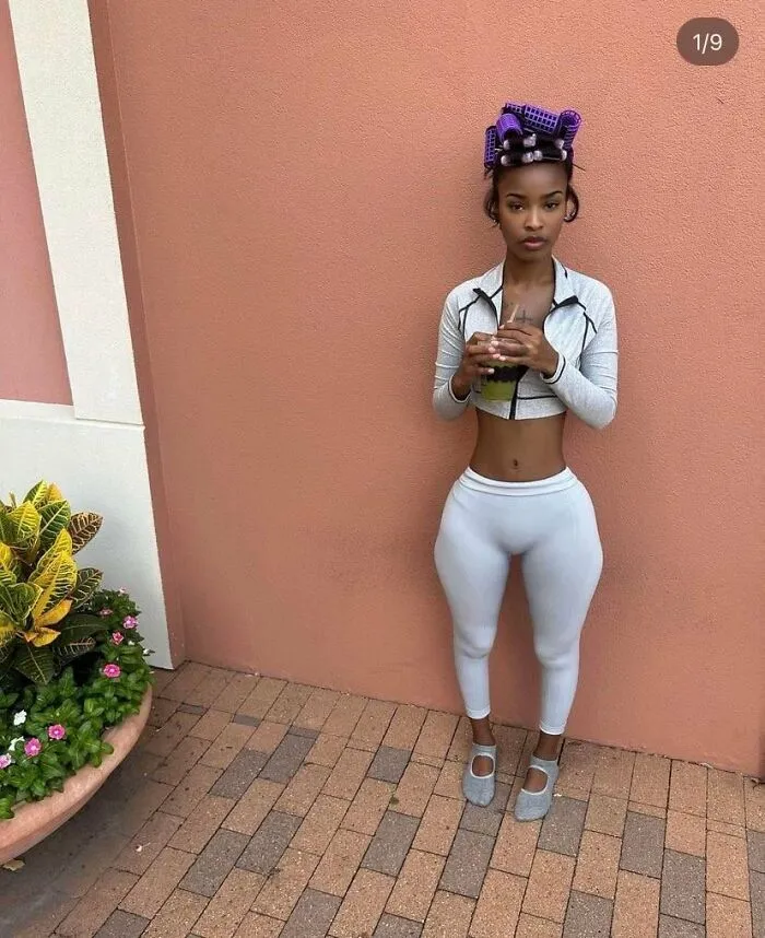 Edited photos with extreme waist slimming and exaggerated hips indoors