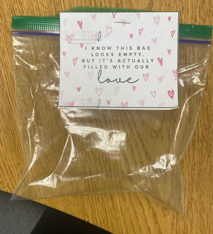 An empty plastic bag with a card attached showing how management gives cheap bonuses.