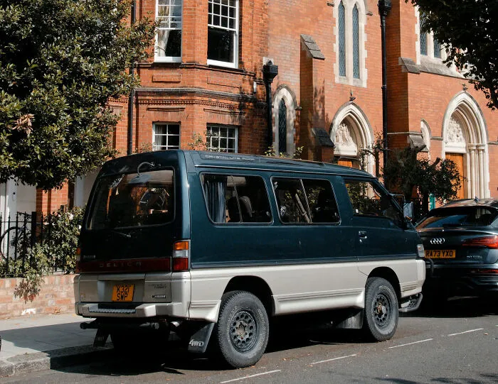 A dark green van parked on a street near strangers who said something that triggered a fight or flight response.