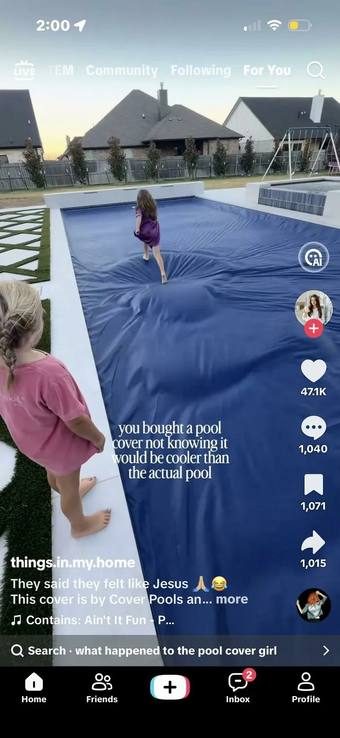 Child walking on a pool cover that looks cooler than the actual pool