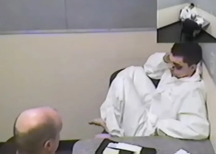 A mugshot of a young man involved in true crime stories