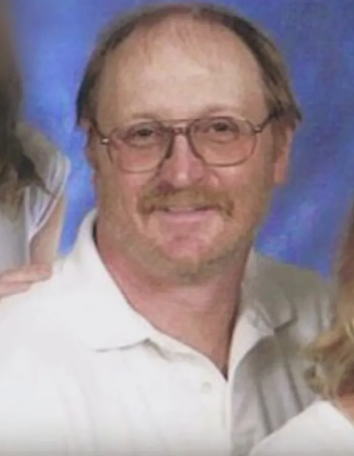 A portrait of a man with glasses and a mustache related to true crime stories