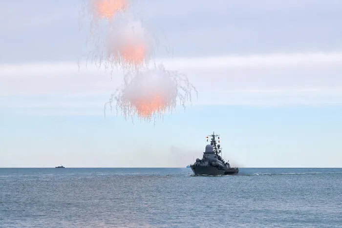 A navy ship firing flares into the sky during military training, evoking chilling scariest true stories vibes