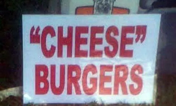 A restaurant sign displaying Cheeseburgers with misused quotation marks around the word cheese.
