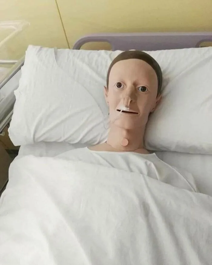 A eerie medical mannequin in a hospital bed, one of many perfectly confusing photos.