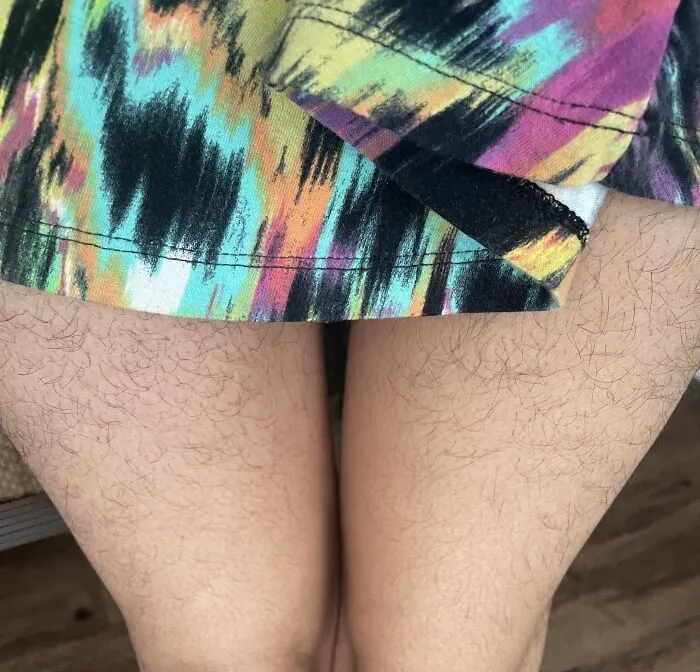 A close up shot of a woman's legs showing body hair related to misconceptions about women's bodies.