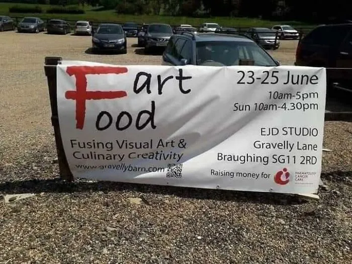 Outdoor banner for Art Food event poorly designed to accidentally spell Fart Food.