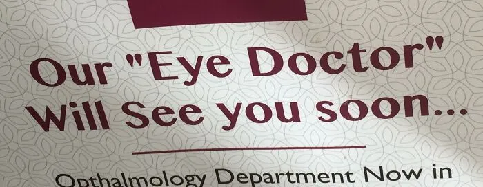 Opthalmology sign that misused quotation marks around the phrase eye doctor.