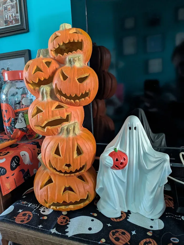 Stacked jack-o-lanterns and a ghost figurine for Halloween homes accent.